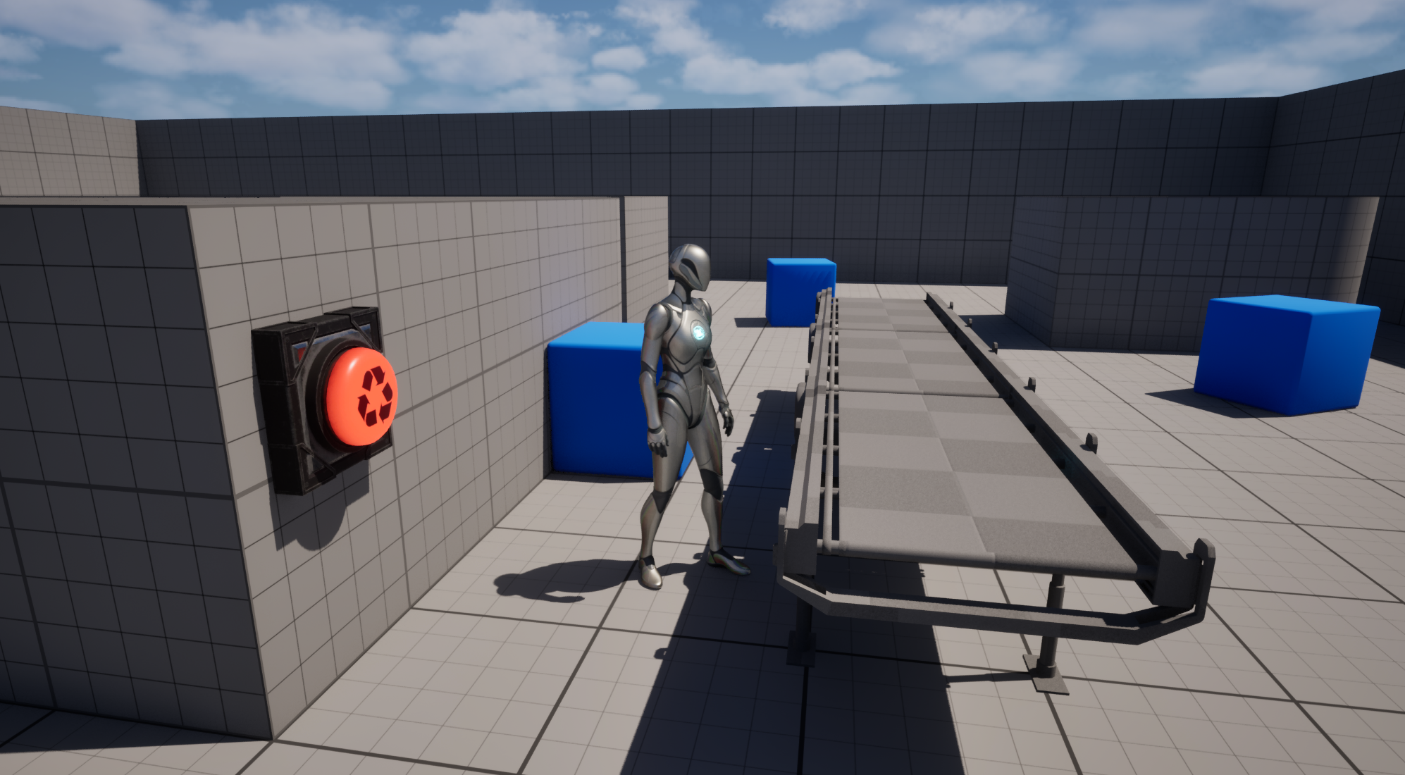 An in-progress development scene showing work-in-progress models for the button and conveyor belt.